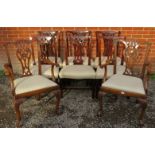 A set of eight (6+2) Georgian mahogany dining chairs, with carved and pierced backs in the