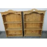 A pair of antique style stripped pine wall hanging shelves, each of three open shelves. Condition