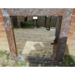 A vintage square wall mirror in a heavily patinated upcycled metal frame. Condition report: No