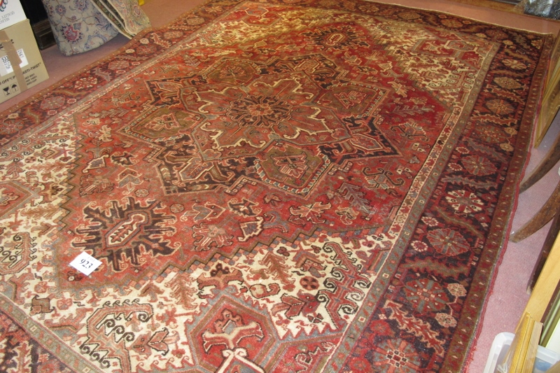 A fine Persian (Iran) carpet, central pattern on claret ground, in very good condition 333 x 258cm.