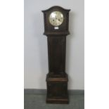 A 1920s Jacobean-Revival oak cased striking 8-day grandmother clock with silvered dial and barley