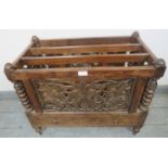 A turn of the century Anglo-Indian hardwood Canterbury, with foliate carved and pierced sides,