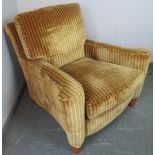 A large bespoke scroll-back armchair by Duresta, upholstered in gold and green striped crushed