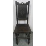 A vintage oak hall chair in the 17th century taste, with carved panel backrest, on ball turned