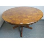 A reproduction 19th century style burr walnut circular breakfast table, the quarter veneered top