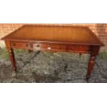 A large Victorian mahogany writing desk, with inset gilt tooled tan leather writing surface, housing