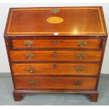 A George III mahogany bureau, with shell inlay and strung with satinwood and ebony, the fall front