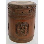 A Chinese carved bamboo caddy jar and cover. Height 16cm. Diameter 12cm. Condition report: No