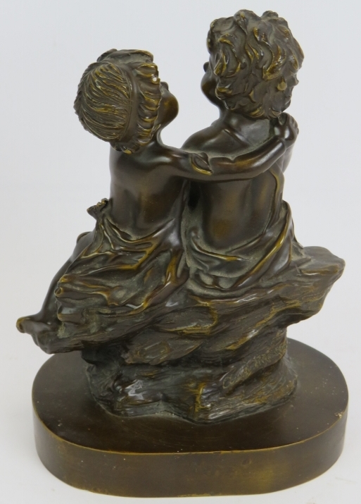 A small bronze figure of two young children sitting on a rock. Bearing signature Aug. Moreau ( - Image 2 of 4