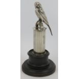 A silver plated car mascot in the form of a Budgerigar perched on a column, circa 1920s, mounted