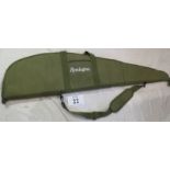 A Remington green shotgun sleeve case in good condition.