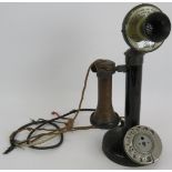 A vintage steel candlestick telephone, height: 32cm. Condition report: Sold as seen.