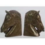 A pair of cast bronze classical horse head bookends. Height: 14cm (PR). Condition report: No issues.