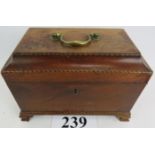 A George III mahogany tea caddy inlaid with satinwood and ebony checkered banding, the hinged lid