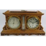 A 19th century Aesthetic Period Negretti & Zambra barometer/clock/thermometer in carved light oak