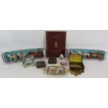 A mixed lot of collectables including a tin of Spade Guineas desk weights, an inscribed copy of