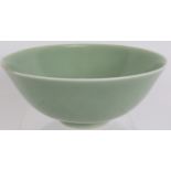 A Chinese porcelain celadon bowl with underglaze incised decoration. Seal mark to base. Diameter: