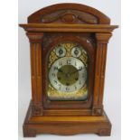 An early 20th century mahogany cased mantel clock with striking and chiming Junghans movement. Key