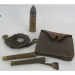 A WWI trench art shell decorated with a shamrock 15, 16, 17, and a WWI Army Issue trench saw, in