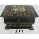 An early Victorian Papier Mache tea caddy, decorated with abalone inlay, painted floral sprays and