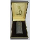A vintage Dunhill model 'S' silver plated cigarette lighter with hammered finish. Original box,