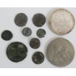 A silver 1885 US Dollar, a Marie Therese Thaler and eight Roman/Greek bronze coins. (10).