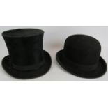 A vintage black bowler hat size 7 1/8 with lining and a vintage black silk top hat (no lining). (2).