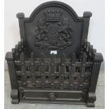 A cast iron freestanding fire-basket featuring backplate depicting a Tudor rose flanked by rampant