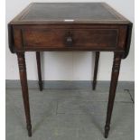 A late Georgian mahogany drop leaf writing table with inset leather adjustable writing surface, over