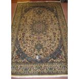 A fine Persian Meshed carpet, central pattern motif, blue on cream heavy pattern and wide borders.