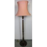 A vintage oak carved and fluted standard lamp, on a circular plinth base. Condition report: No