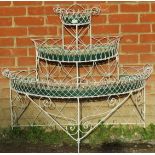 A 19th century wirework demi-lune plantstand of three graduated tiers with original tin liners, on