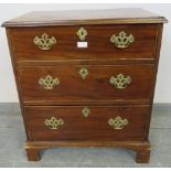 A Georgian mahogany chest of small proportions, housing three graduated cock-beaded drawers with