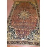 A North West Persian Bidjar carpet, central floral motif on dusky pink ground. Good condition. 195 x