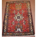 A Hamadan rug, 3 central motifs, stylised insects, some colour irregularity, no damage 165cm x