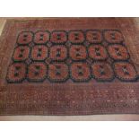 A nice quality vintage Persian rug, decorated with a central field of 18 stylised panels within