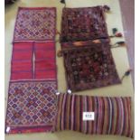 Three Persian saddle bags, one now a cushion. In fair - good condition.