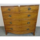 A George III mahogany bow-fronted chest of two short over three long graduated cock-beaded drawers