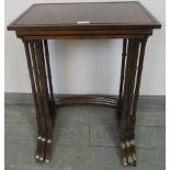 An Edwardian Regency Revival nest of three mahogany tables, strung with ebony, on faux bamboo