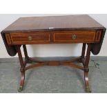 A good quality Regency style sapele mahogany sofa table made by Kelly of Southern Rhodesia, with