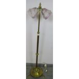 An Edwardian brass height adjustable telescopic standard lamp, with twin Art Deco marbled shades, on