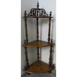 A Victorian walnut three-tier corner whatnot with turned uprights and marquetry inlay. Condition