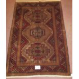 A Turkish Kazak rug, a repeat tri pattern on soft muted ground, clean rug in condition 189 x 127cm.