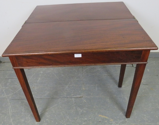 A turn of the century mahogany turnover tea table with single blind drawer, on square supports. - Image 4 of 5