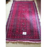 A mid 20th century Persian Bokara rug, 6 central repeat patterns on burgundy ground. Slight
