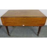 A late Georgian walnut Pembroke table, with single drawer and dummy drawers, on tapering supports