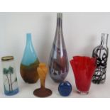 Three large studio glass vases, a Galle style lamp base, a small blue vase, a mid century red wavy