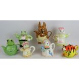 Seven novelty teapots formed as various animals including frogs, rabbit, mouse, duck and tiger.