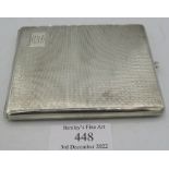 A silver cigarette case with gilded interior and engine turned decoration, Chester 1928. Approx