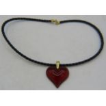 A Lalique heart shaped pendant on a leather strap, lobster clasp 18ct yellow gold, boxed. Approx